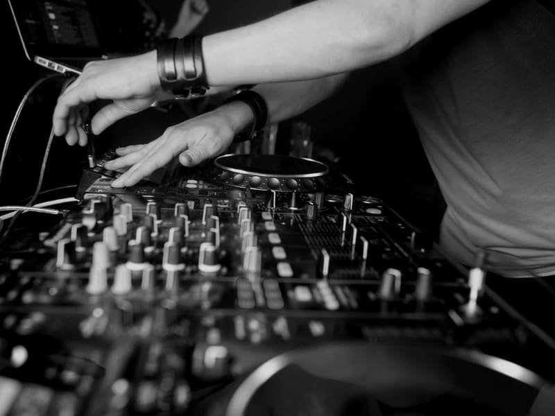 DJ working with professional music equipment